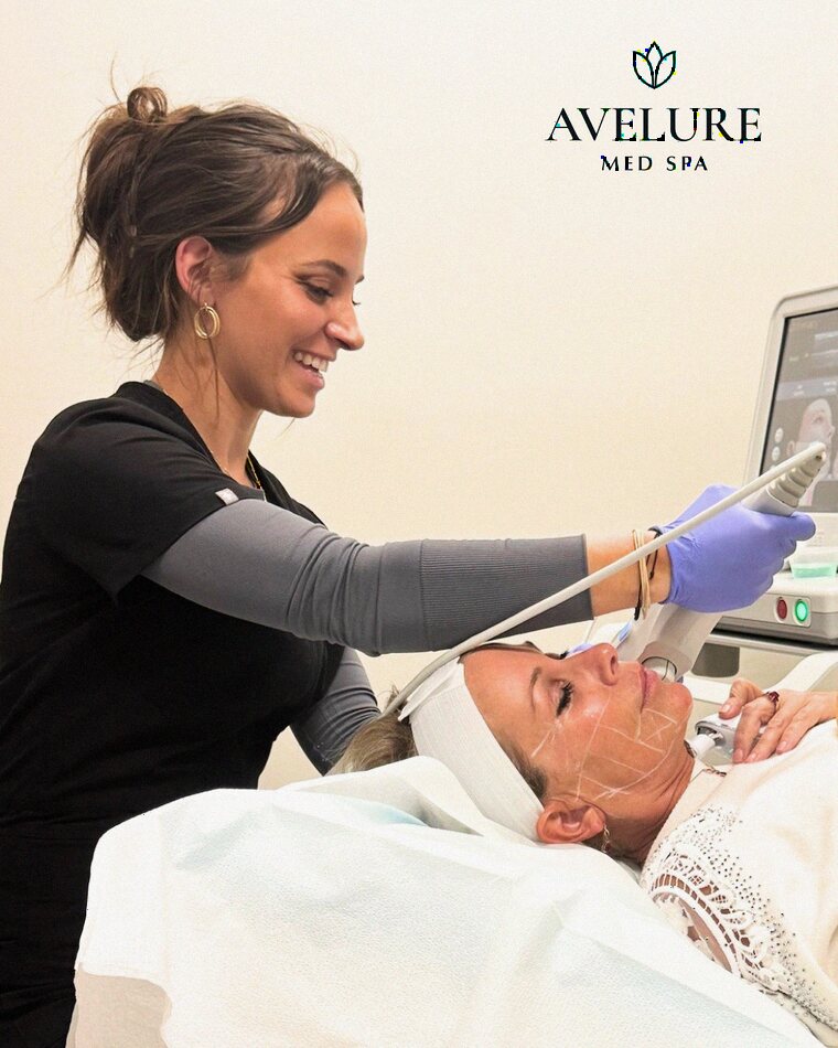 An Avelure provider performing a facial treatment in the studio